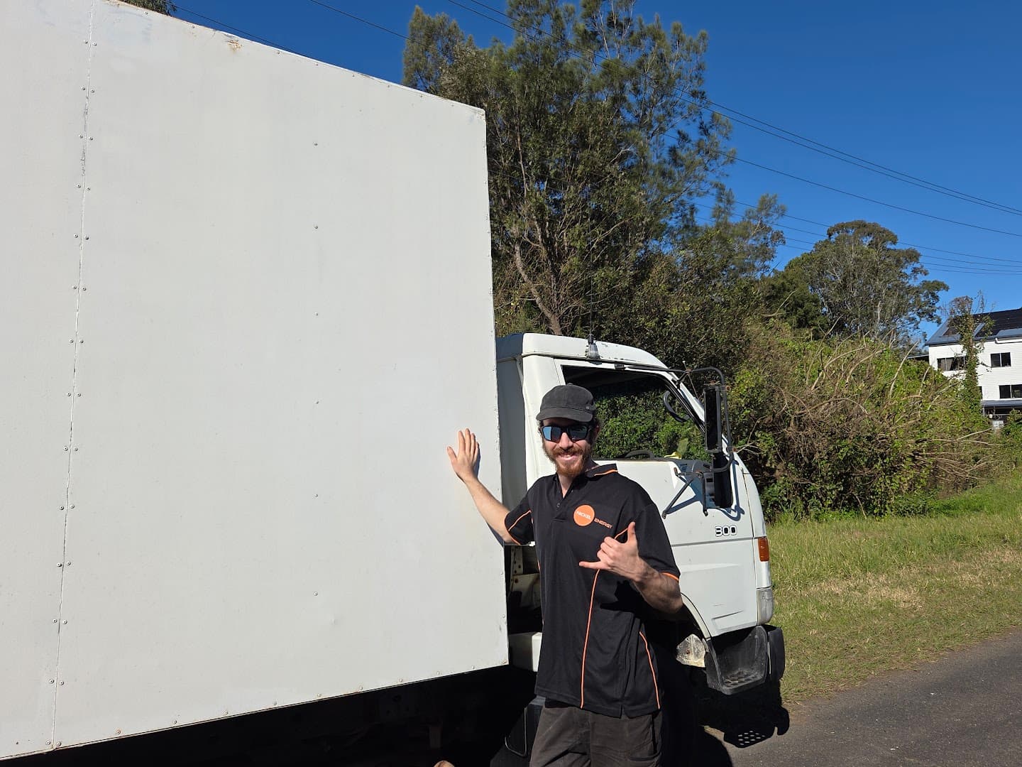 A Northern Removals truck on a job in the Northern Rivers, crew member at the tailgate